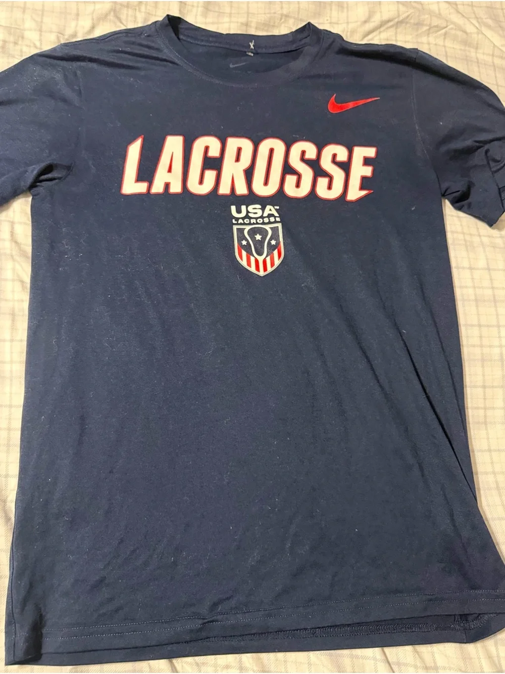 Nike Men's Navy Lacrosse Graphic Tee with Red Accents